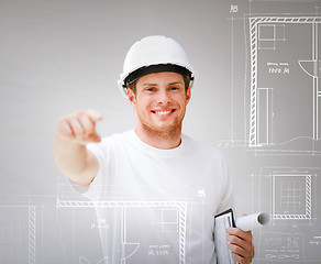 Image showing architect with blueprint pointing at you