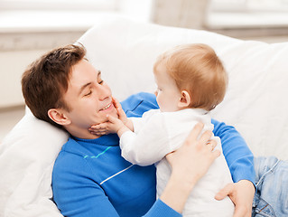 Image showing happy father with adorable baby