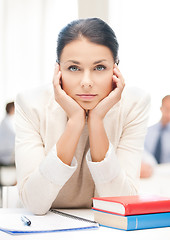 Image showing stressed businesswoman in office