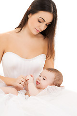 Image showing bride in white dress with little baby