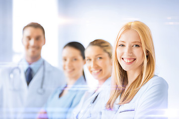 Image showing female doctor in front of medical group