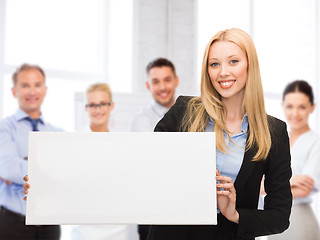 Image showing businesswoman with white blank board