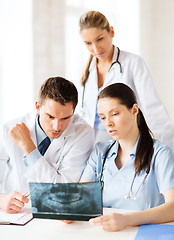 Image showing group of doctors looking at x-ray