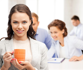 Image showing beautiful businesswoman with cup of coffee