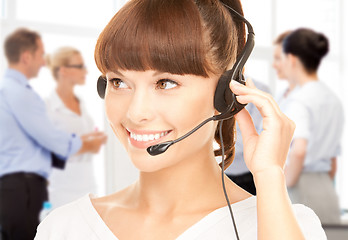 Image showing helpline operator with headphones in call centre