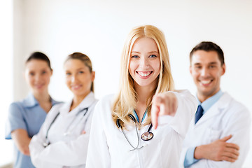 Image showing female doctor in front of medical group