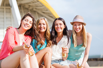 Image showing girls with drinks on the beach