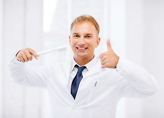 Image showing dentist with toothbrush in hospital