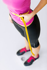 Image showing trained belly with measuring tape