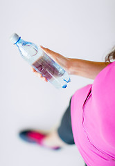 Image showing sporty woman with bottle of water