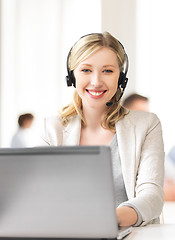 Image showing helpline operator with headphones in call centre