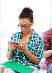 Image showing african student browsing in smartphone at school