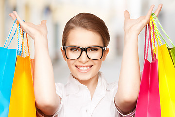 Image showing woman with shopping bags in ctiy