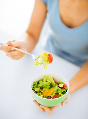 Image showing woman eating salad with vegetables