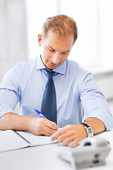 Image showing handsome businessman working in the office