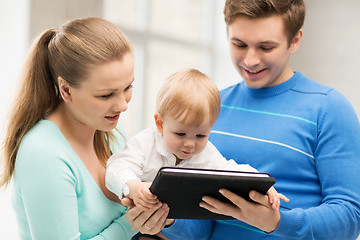 Image showing parents and adorable baby with tablet pc