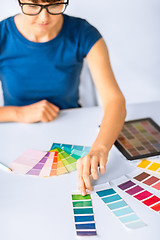 Image showing woman working with color samples for selection