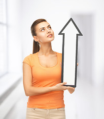 Image showing smiling woman with direction arrow sign