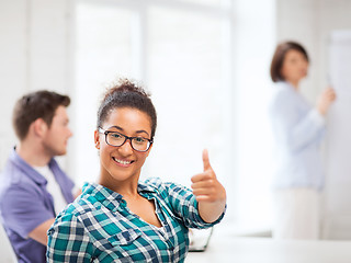 Image showing african student girl showing thumbs up