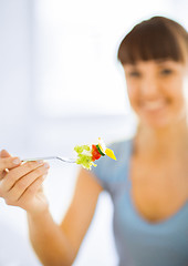 Image showing woman hand holding fork with vegetables