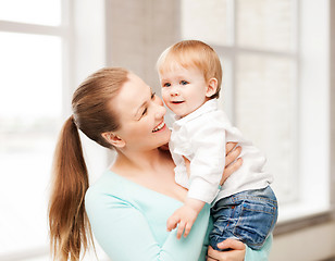 Image showing happy mother with adorable baby