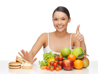 Image showing woman with fruits showing thumbs up