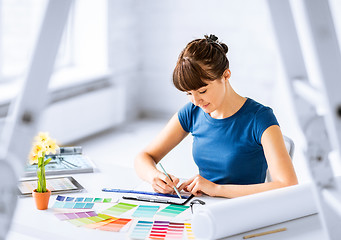 Image showing woman working with color samples for selection