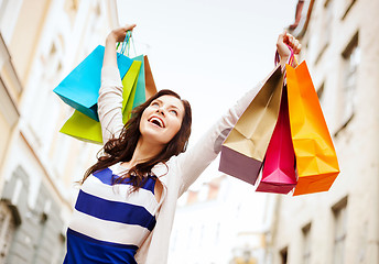 Image showing woman with shopping bags in ctiy