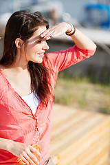 Image showing girl with drink on the beach