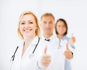 Image showing team of doctors showing thumbs up