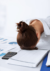 Image showing woman sleeping at work in funny pose