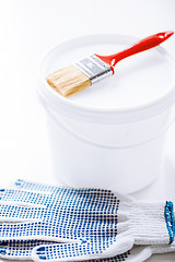 Image showing paintbrush, paint pot and gloves