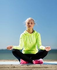 Image showing woman doing yoga outdoors