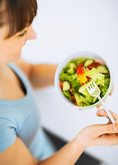 Image showing woman eating salad with vegetables