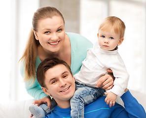 Image showing happy parents playing with adorable baby