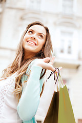 Image showing woman with shopping bags in ctiy