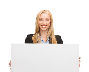 Image showing businesswoman with white blank board