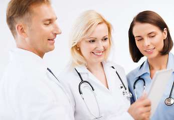 Image showing doctors looking at tablet pc