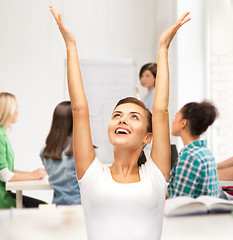 Image showing happy student girl with hands up