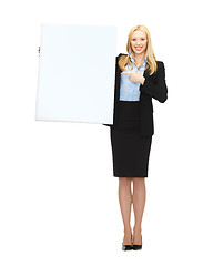 Image showing businesswoman with white blank board