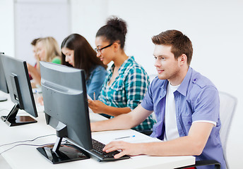 Image showing student with computer studying at school