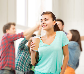 Image showing student holding take away coffee cup in college