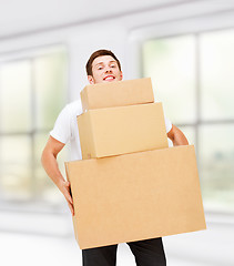 Image showing young man carrying carton boxes