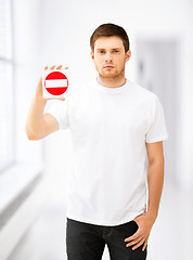 Image showing young man showing no entry sign