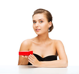 Image showing woman with diamond earrings and gift box