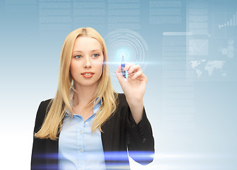 Image showing businesswoman working with virtual screen