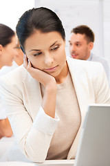 Image showing businesswoman with laptop computer at work