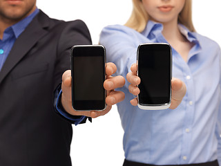 Image showing woman and man hands with smartphones