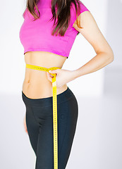 Image showing trained belly with measuring tape