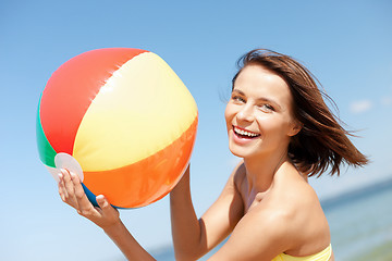 Image showing girl in bikini playing ball on the beach